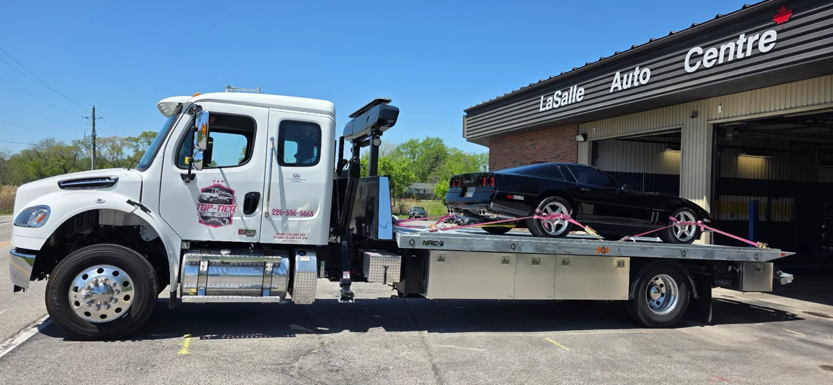 Top-Tier Towing flatbed truck fitted with four DAKEN ZEN stainless steel toolboxes, in service at LaSalle Auto Centre